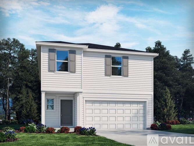 A modern house with a white exterior and a large garage door.