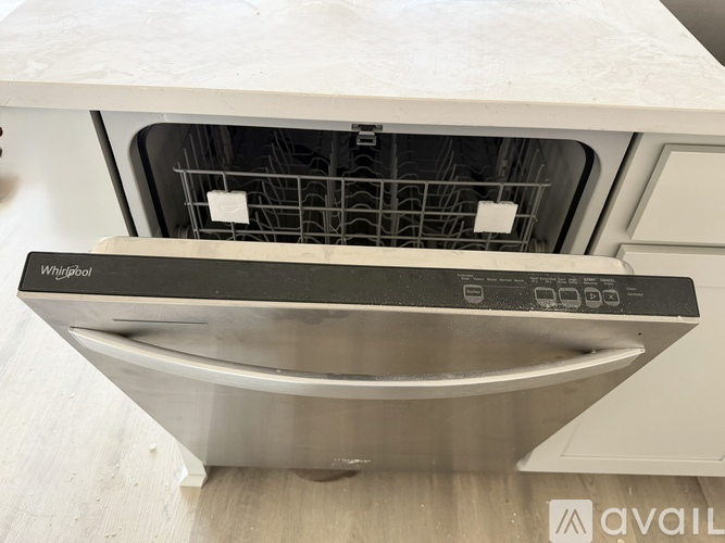 A Whirlpool dishwasher is shown from the front view.