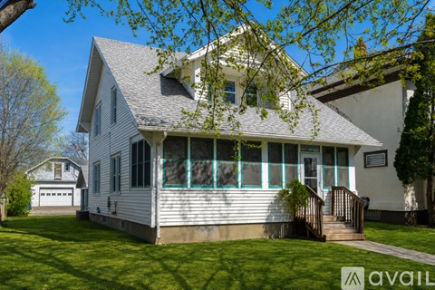 A house with a white door and a small porch.