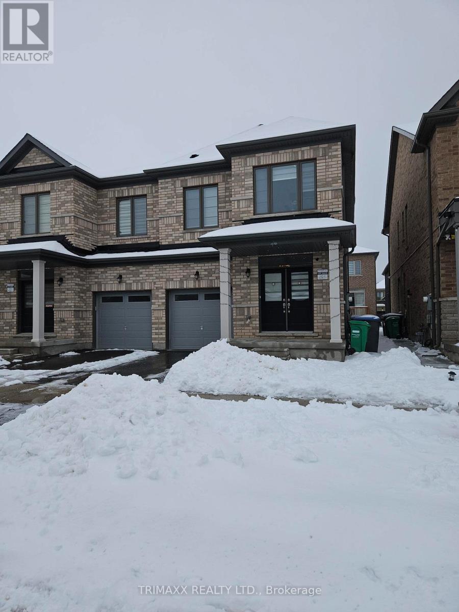 A house with a snow-covered front yard.
