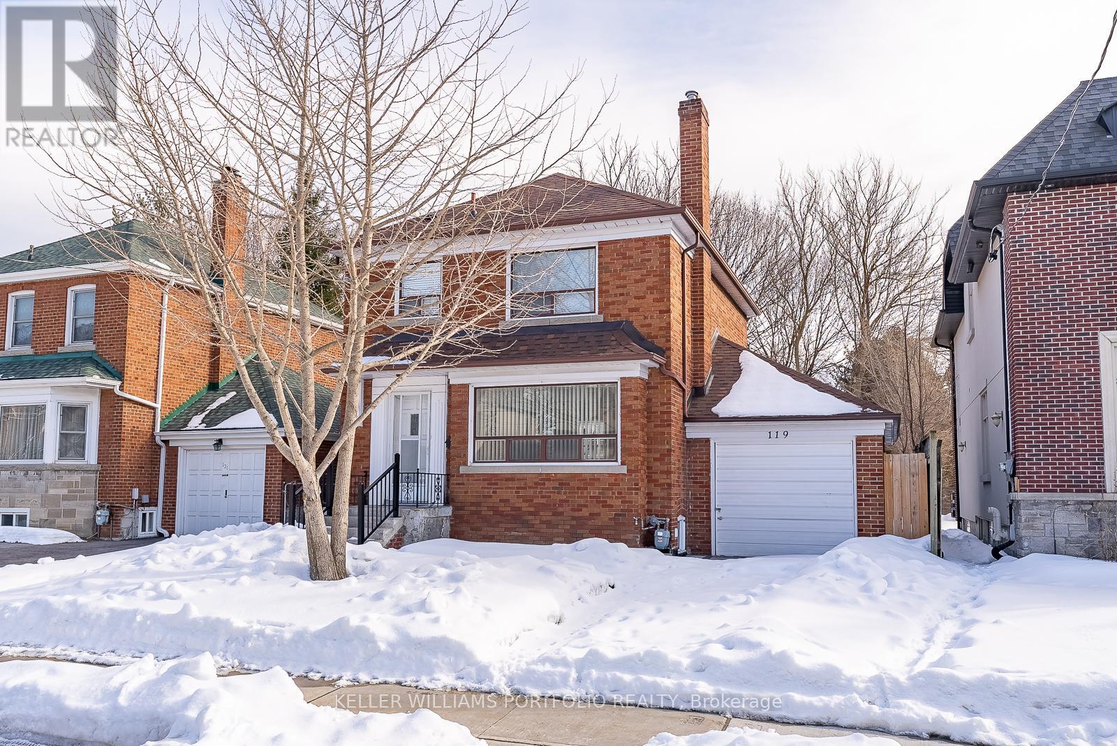 A house with a snow-covered front yard.