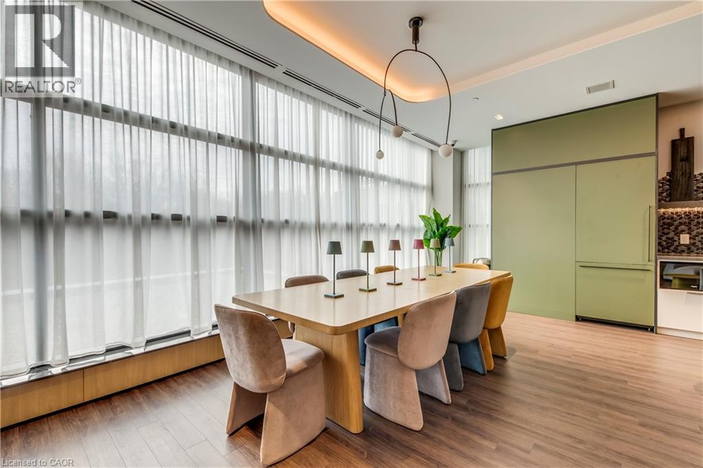 A modern dining room with a table and chairs.