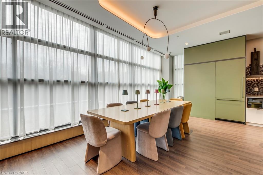 A modern dining room with a table and chairs.