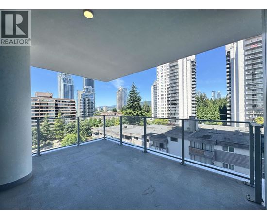 A balcony with a view of the cityscape.