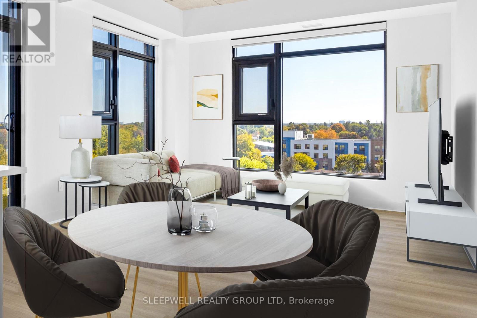 A modern living room with a large table and chairs.