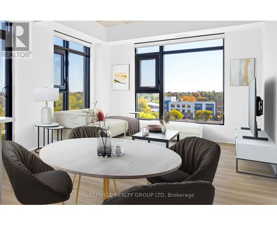 A modern living room with a large table and chairs.