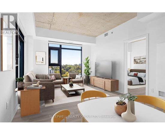 A modern living room with a large window and a flat screen TV.