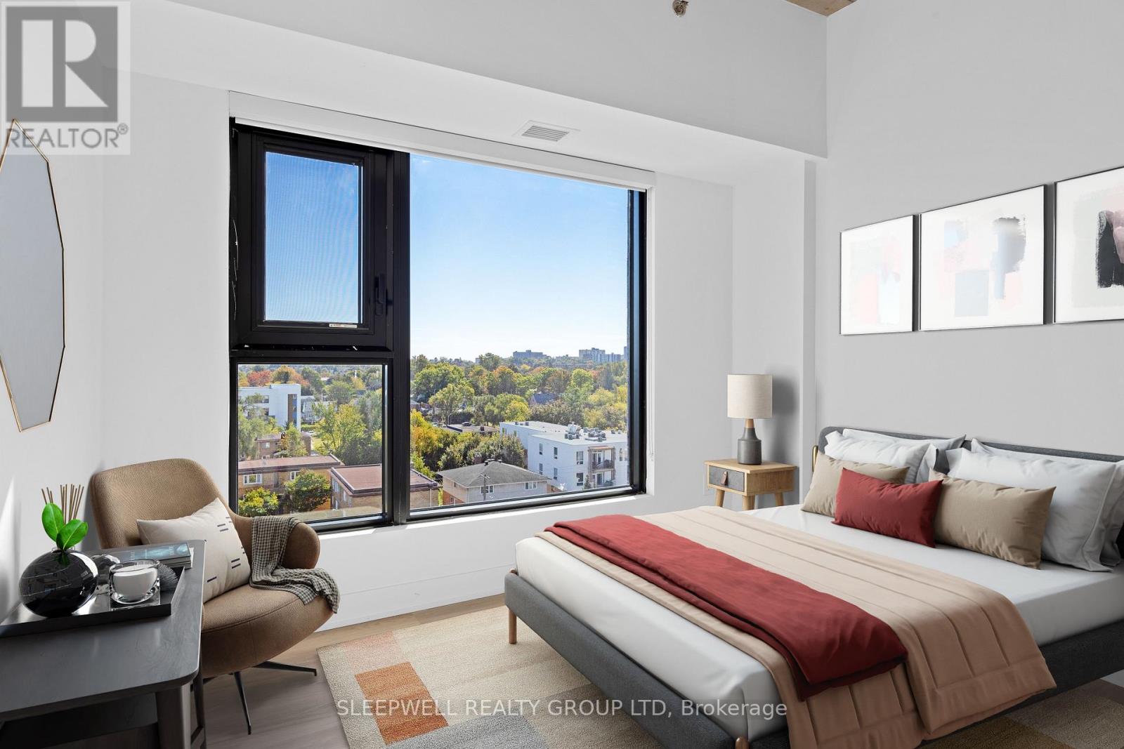 A bedroom with a large bed and a view of the city.
