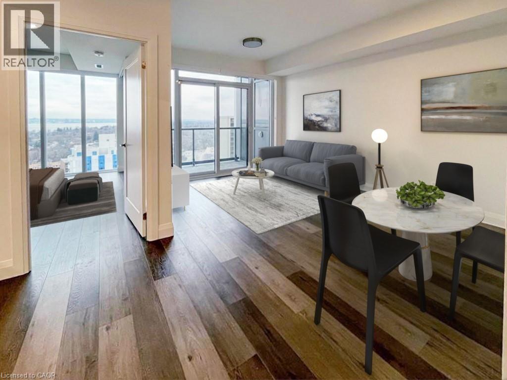 A living room with a couch, chairs, and a table with a plant on it.