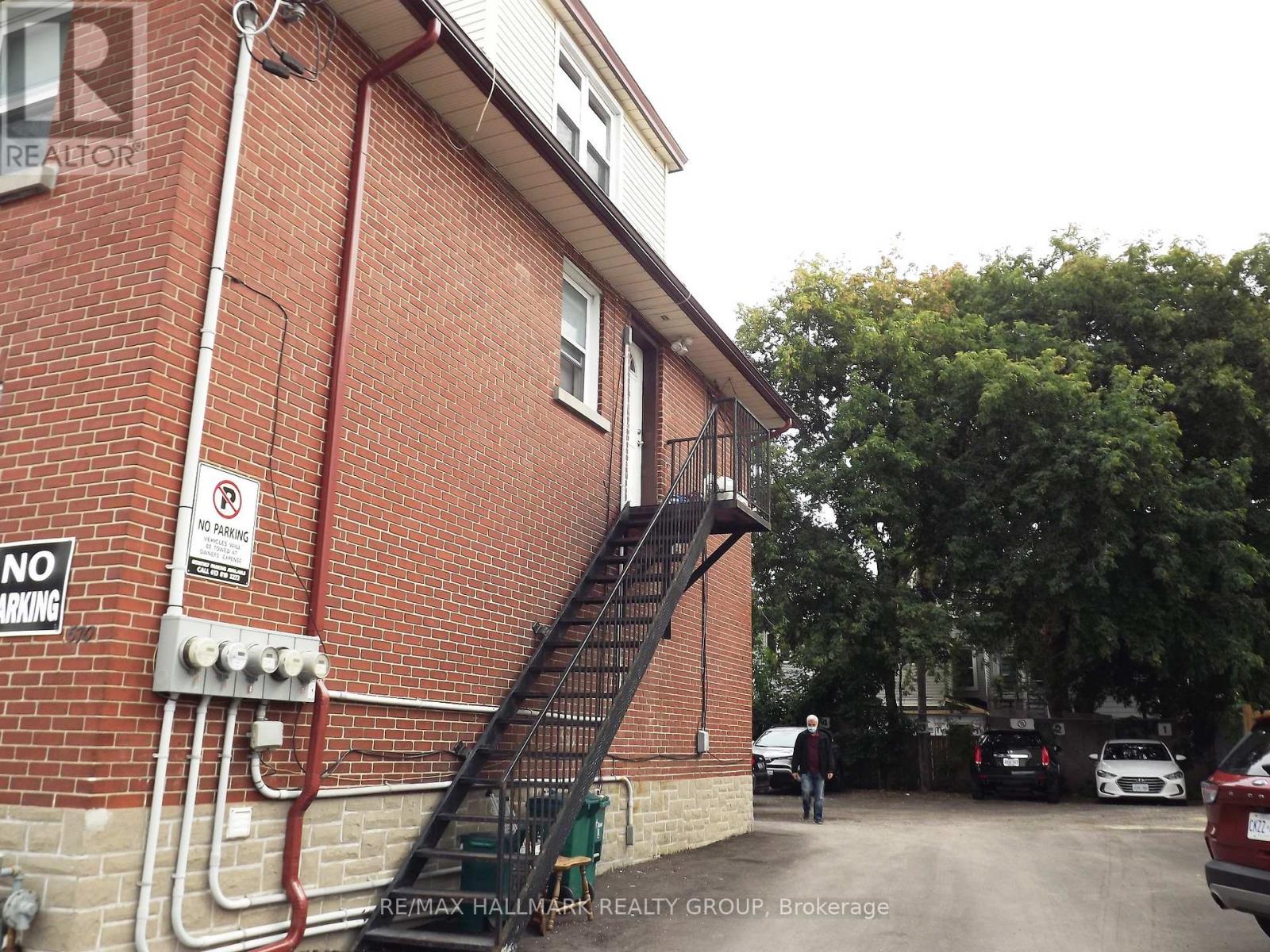 A building with a staircase leading to the second floor.