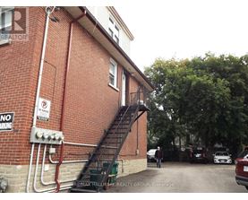 A building with a staircase leading to the second floor.