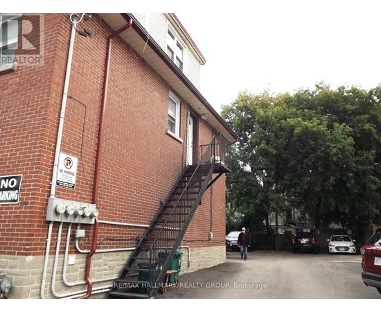 A building with a staircase leading to the second floor.
