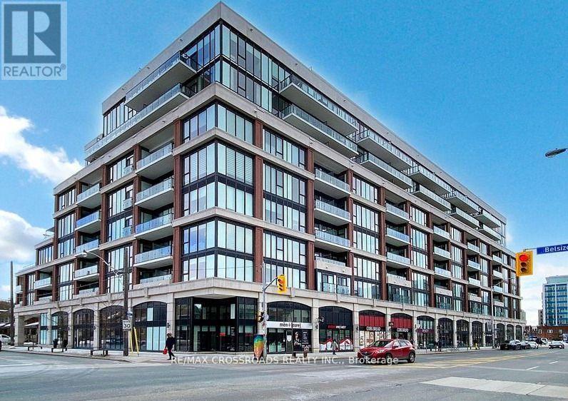 A large building with many windows is the focus of this image.