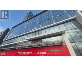 A tall building with a red sign that says "Elevate the new standard. WASAN SUPERMARKET!".
