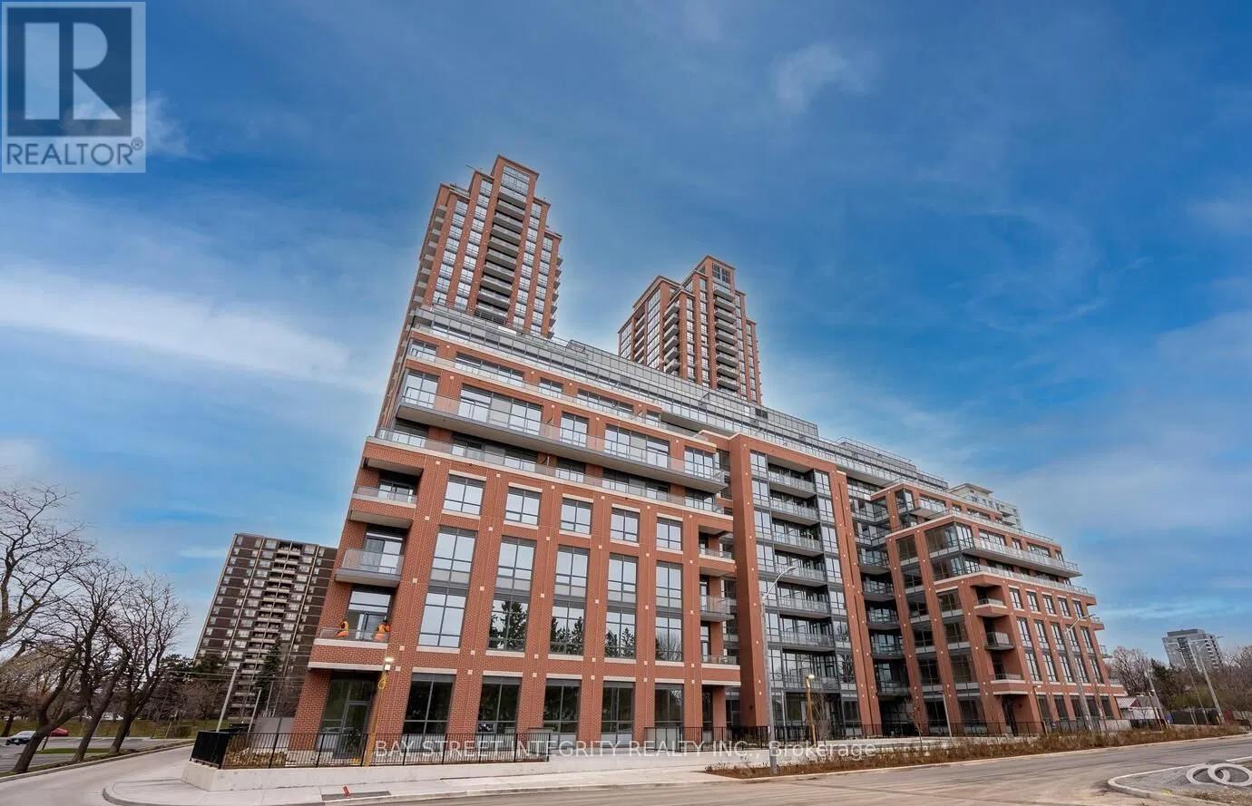 A large red brick building with the words "BAY RED REAL ESTATE" on the front.