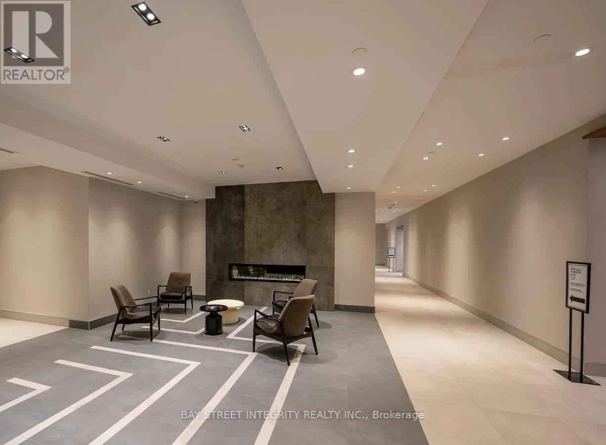 A spacious waiting area with chairs and a reception desk.