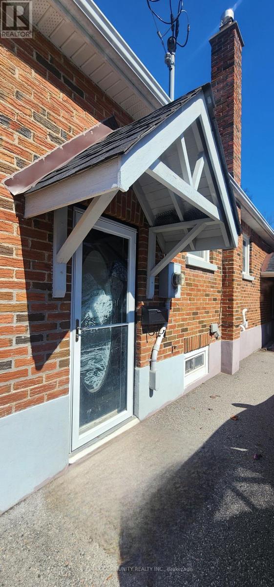 A house with a white awning over a door.