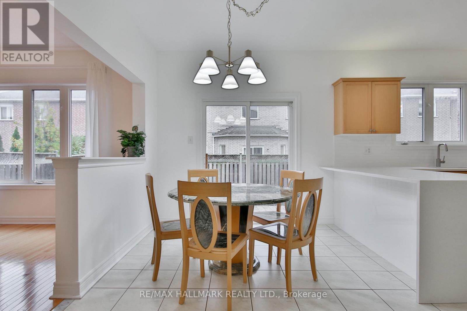 A dining room with a table set for four.