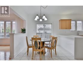 A dining room with a table set for four.