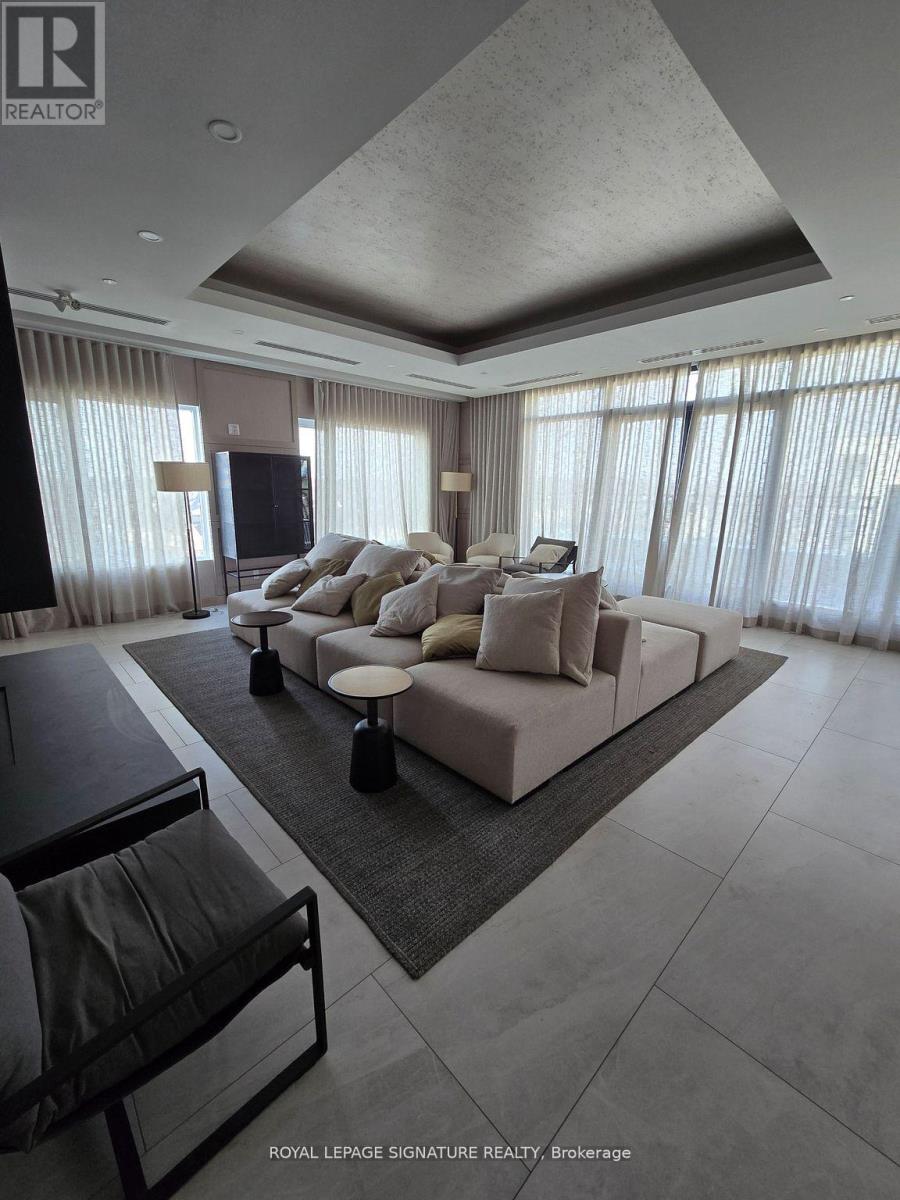 A modern living room with a large sectional sofa and a flat screen TV.