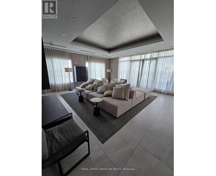 A modern living room with a large sectional sofa and a flat screen TV.