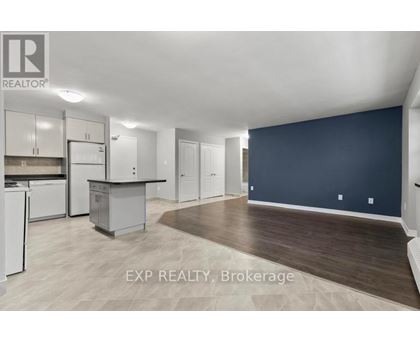 A kitchen area with a dining table and chairs.