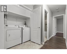 A laundry room with a washer and dryer.