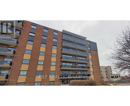 A tall apartment building with the words EXP REALTY Brokerage on the side.