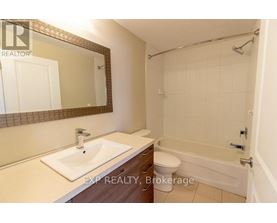 A bathroom with a sink, toilet, and bathtub.