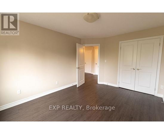 A room with a doorway leading to another room.