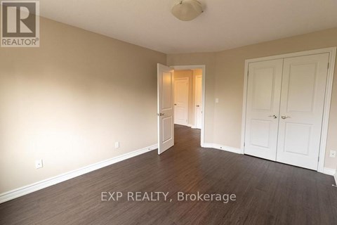 A room with a doorway leading to another room.