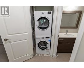 A white door with a Realty logo on it.
