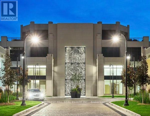 A modern building with a large glass door and the logo "REALTOR" on the top left corner.