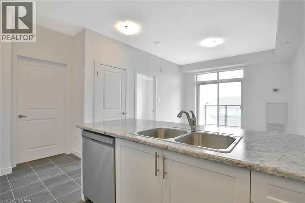 A kitchen with a sink and a window.