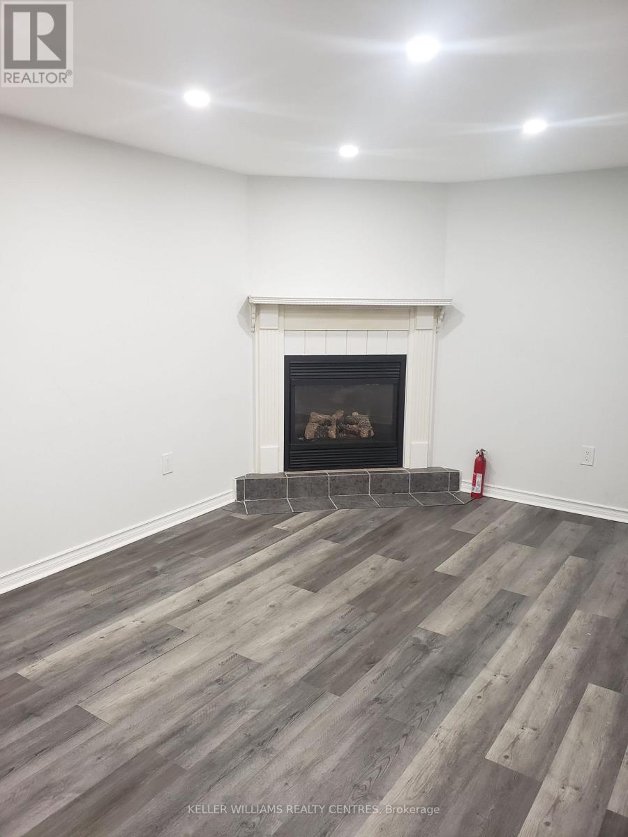A room with a fireplace and a fire extinguisher.