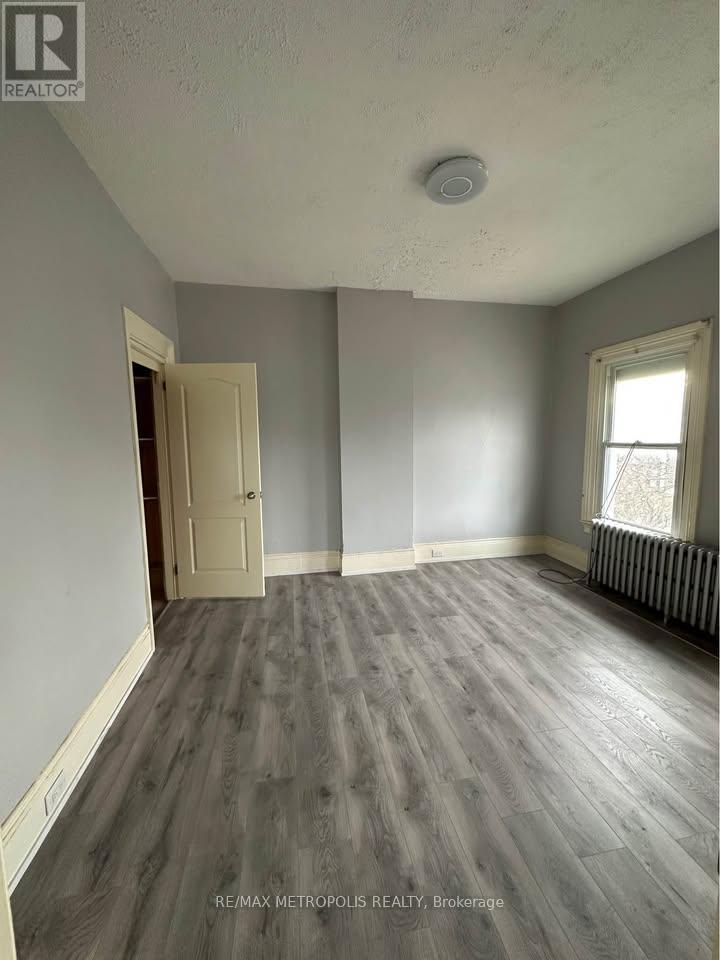 A room with a door and a window.
