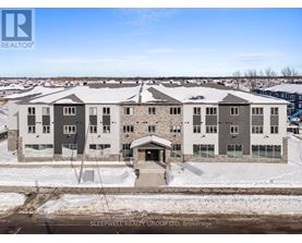A large building with the words Sleepwell Realty Group Ltd on it.