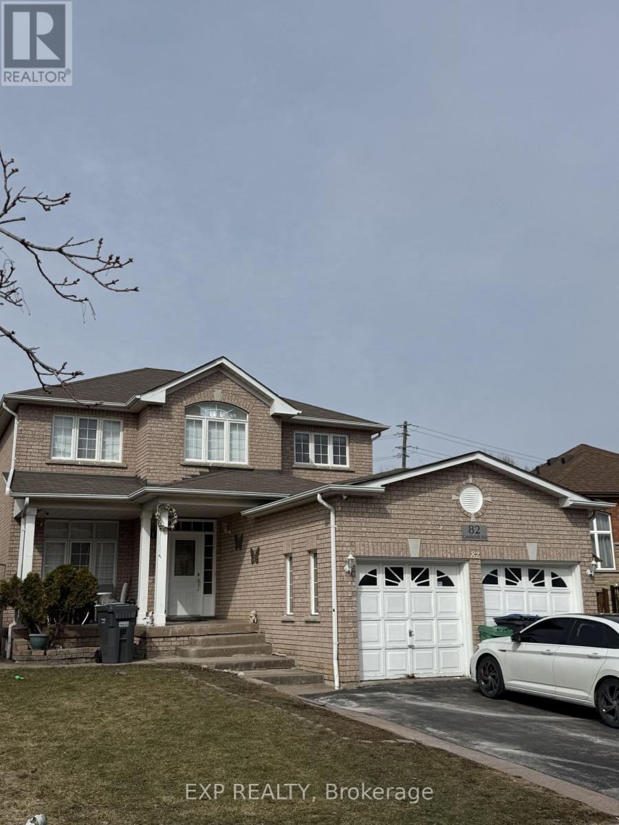 A house with a white car in front of it.