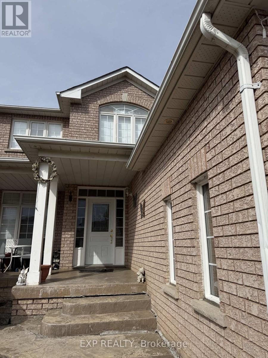 A house with a white door and a porch with a white railing.