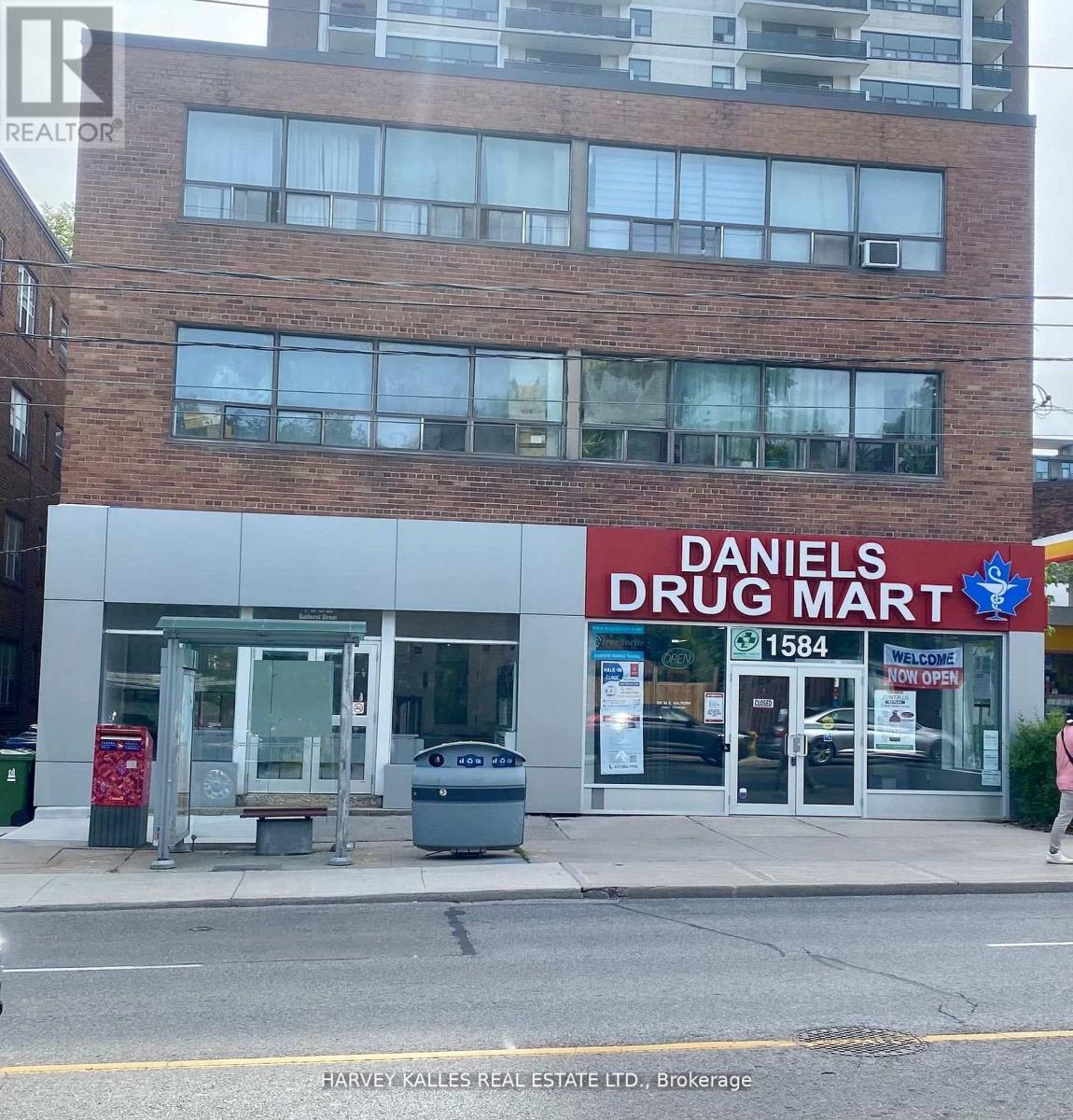A Daniel's Drug Mart storefront with a sign that reads 1584.