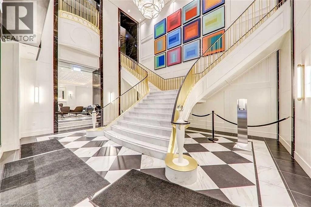 A staircase with a black and white checkered floor.