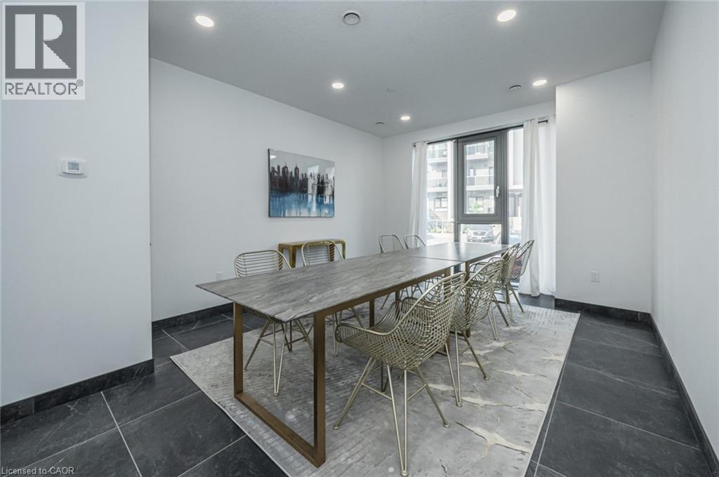 A dining room with a wooden table and chairs.
