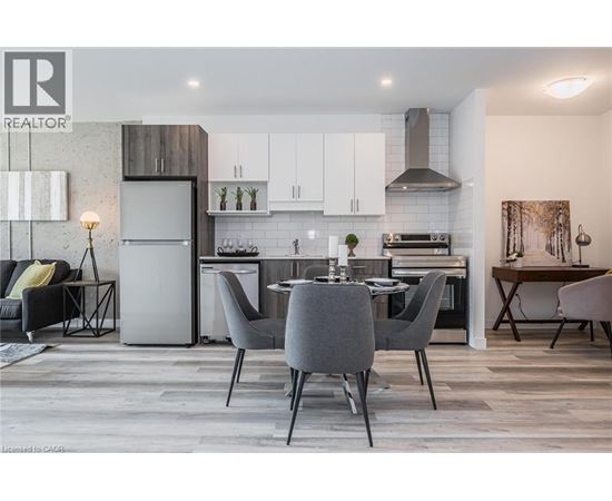 A modern kitchen with a dining table set for four.