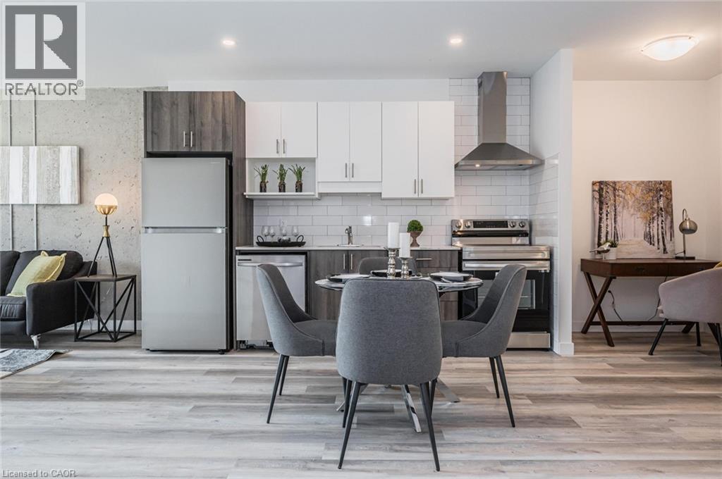 A modern kitchen with a dining table set for four.