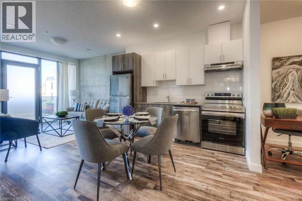 A modern kitchen with a dining table set for four.