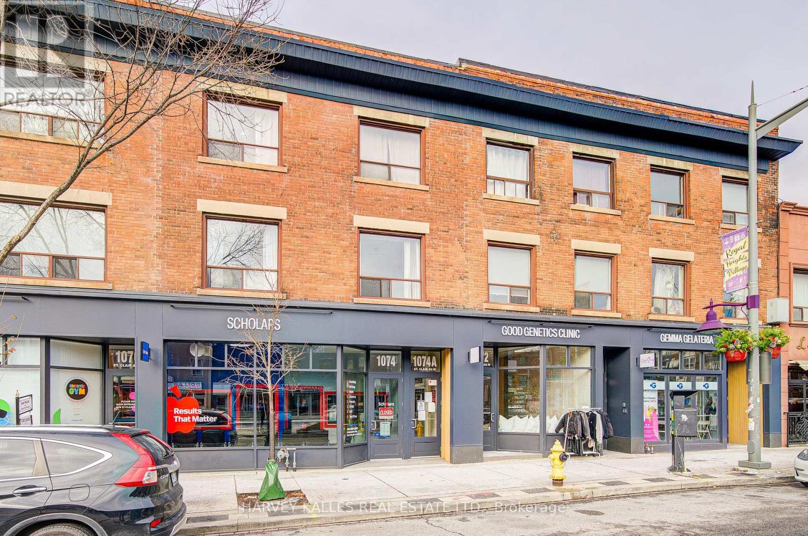 A street view of a building with the sign "SCHOLAPS" on the ground floor.