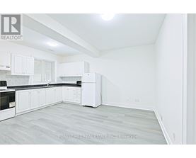 A white kitchen with Forest Hill Real Estate Inc. Brokerage watermark.