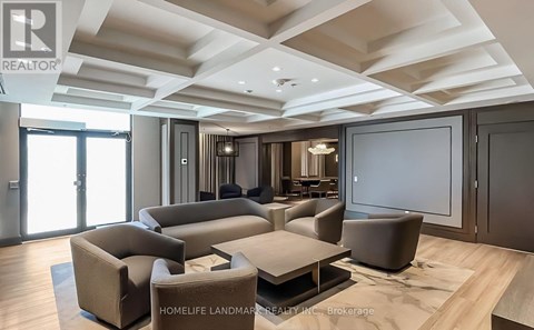 A spacious living room with a large sectional sofa and a coffee table.