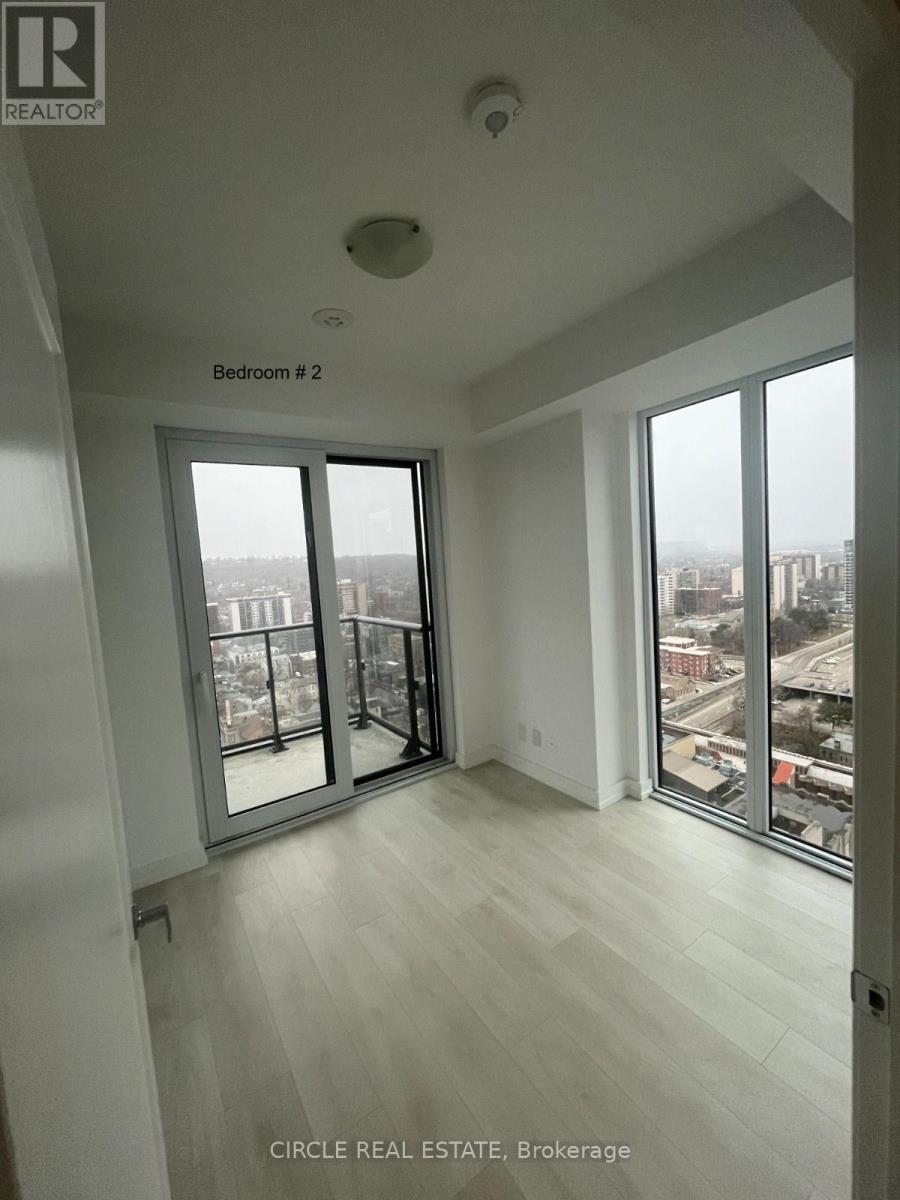 Bedroom 2 has a view of the city.