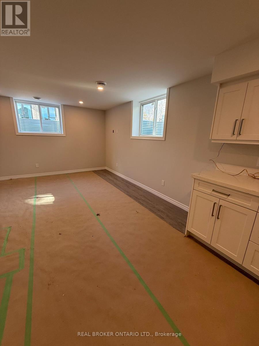 A room with a brown floor and green lines drawn on it.